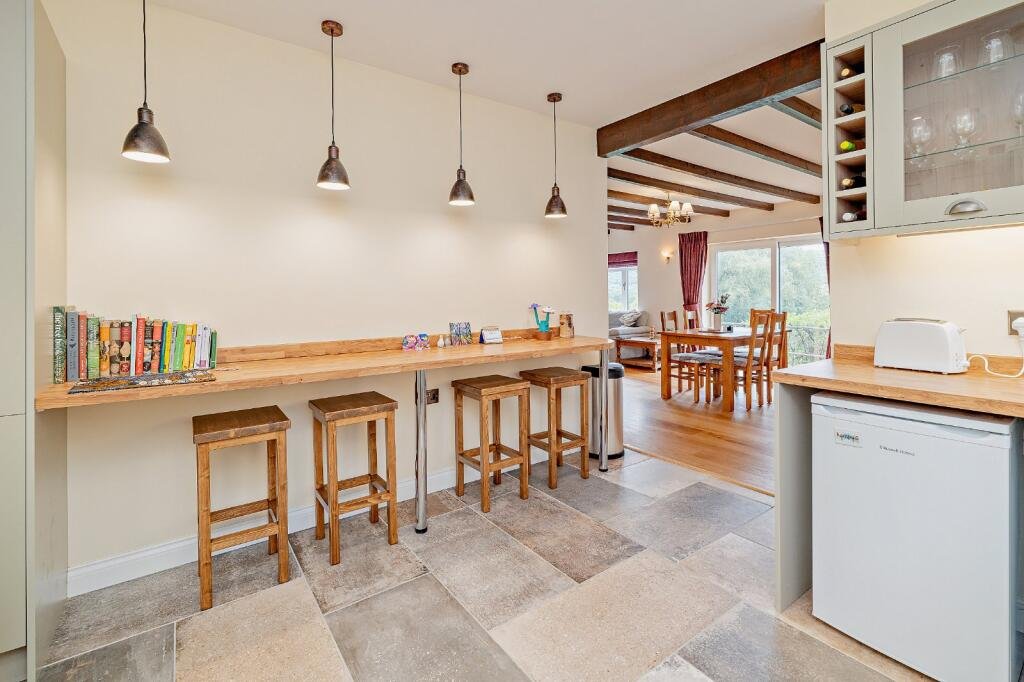 Secluded £520k woodland home in Shrewsbury with two bedrooms nearly one acre of gardens rare plants historic mine features and stunning views offers ultimate privacy.