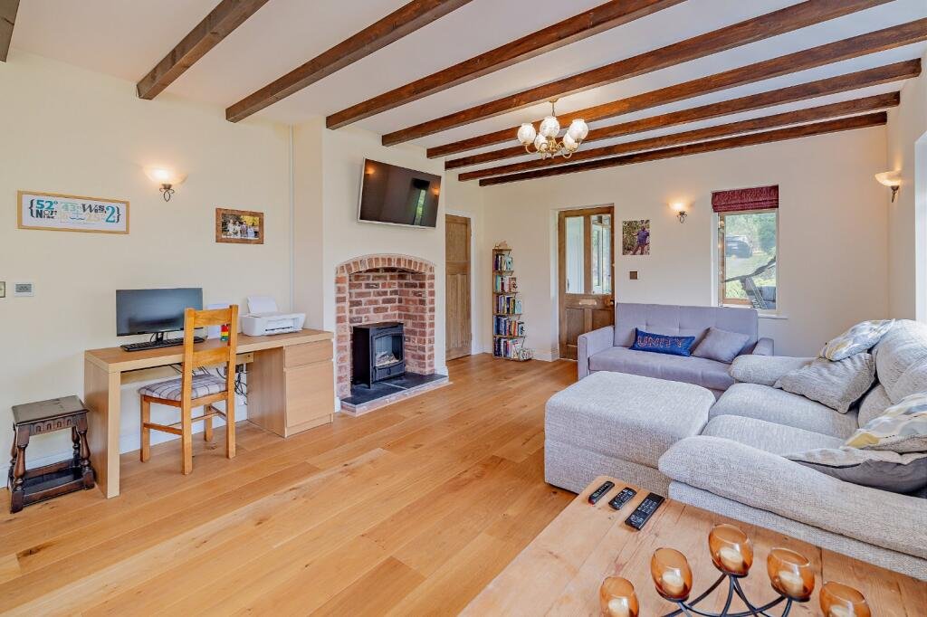 Secluded £520k woodland home in Shrewsbury with two bedrooms nearly one acre of gardens rare plants historic mine features and stunning views offers ultimate privacy.