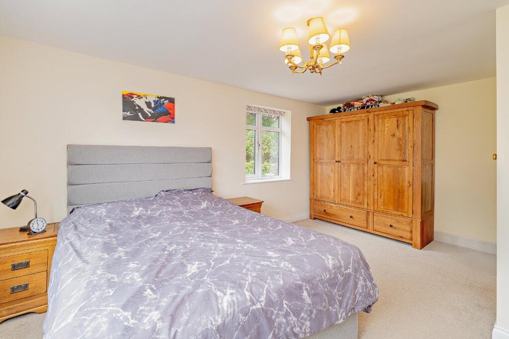 Secluded £520k woodland home in Shrewsbury with two bedrooms nearly one acre of gardens rare plants historic mine features and stunning views offers ultimate privacy.