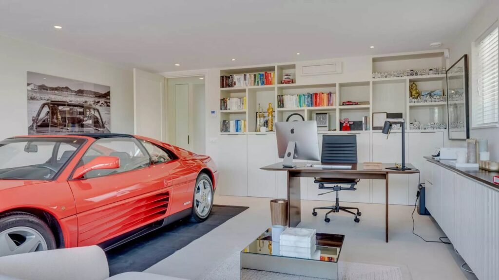 Thatched villa near Amsterdam features luxury interiors, a private boathouse, and a rare home office where you can park two supercars beside your desk.