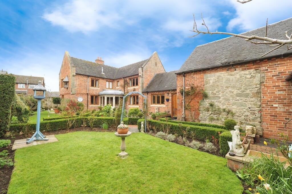 Family home in Hemington for £840,000 features modern comforts plus rare ruins of a 13th century Grade II listed chapel, a secret garden and a refurbished stone barn.