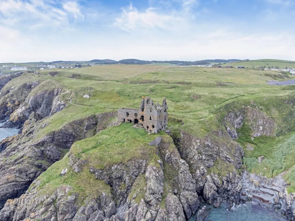 Dunskey Castle ruins on a cliff in Scotland with sea views to Northern Ireland are on sale for offers over £100,000 offering eight acres of land and historic allure.