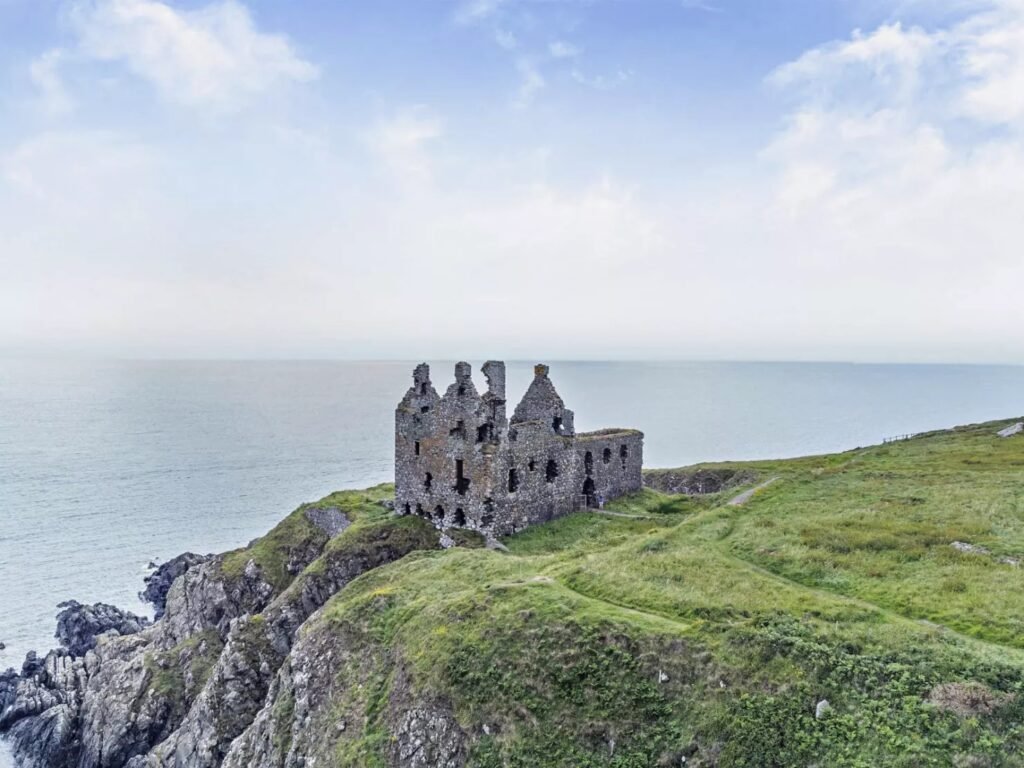 Dunskey Castle ruins on a cliff in Scotland with sea views to Northern Ireland are on sale for offers over £100,000 offering eight acres of land and historic allure.