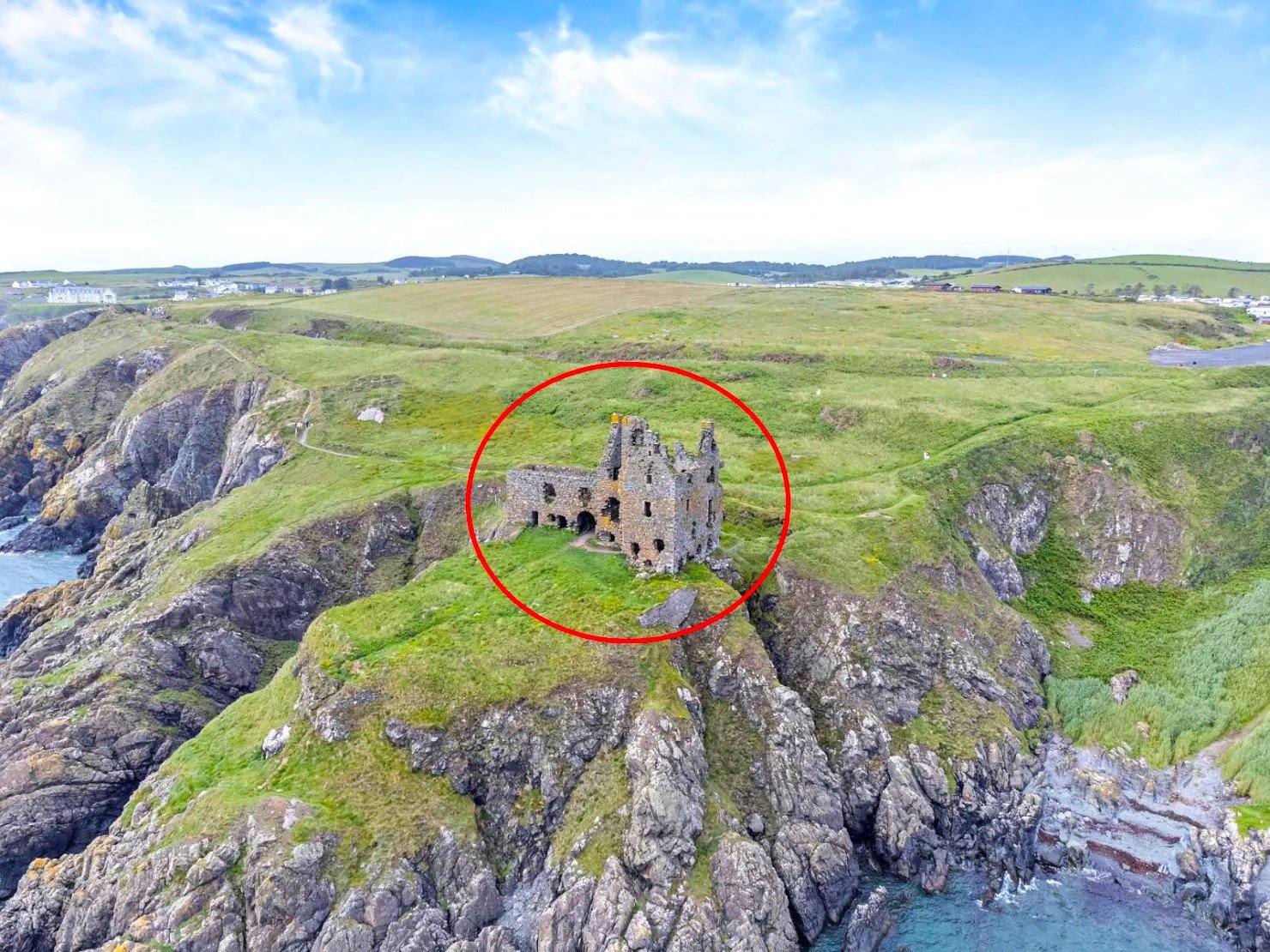 Dunskey Castle ruins on a cliff in Scotland with sea views to Northern Ireland are on sale for offers over £100,000 offering eight acres of land and historic allure.