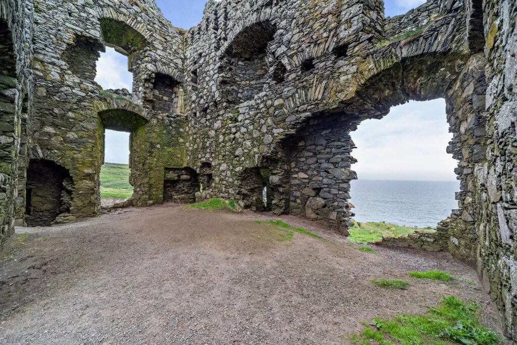Dunskey Castle ruins on a cliff in Scotland with sea views to Northern Ireland are on sale for offers over £100,000 offering eight acres of land and historic allure.