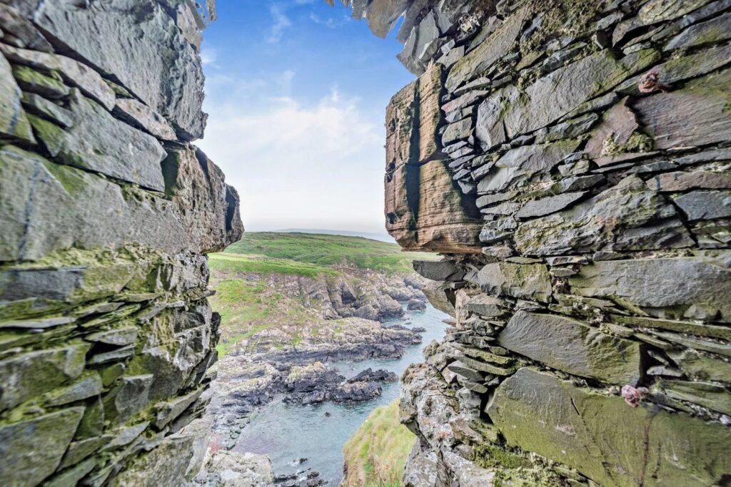 Dunskey Castle ruins on a cliff in Scotland with sea views to Northern Ireland are on sale for offers over £100,000 offering eight acres of land and historic allure.