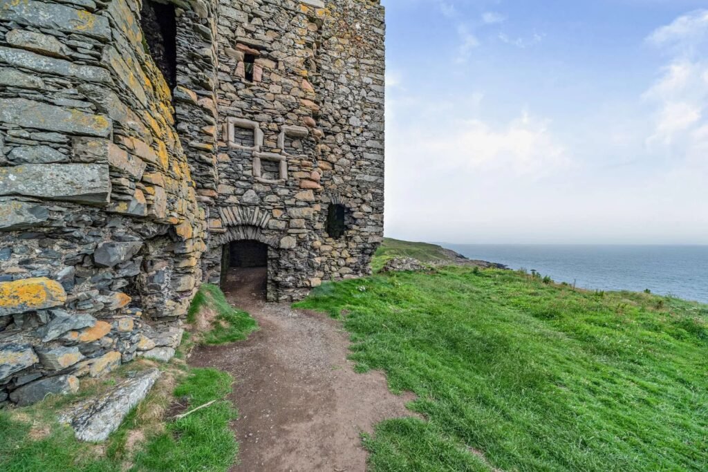 Dunskey Castle ruins on a cliff in Scotland with sea views to Northern Ireland are on sale for offers over £100,000 offering eight acres of land and historic allure.