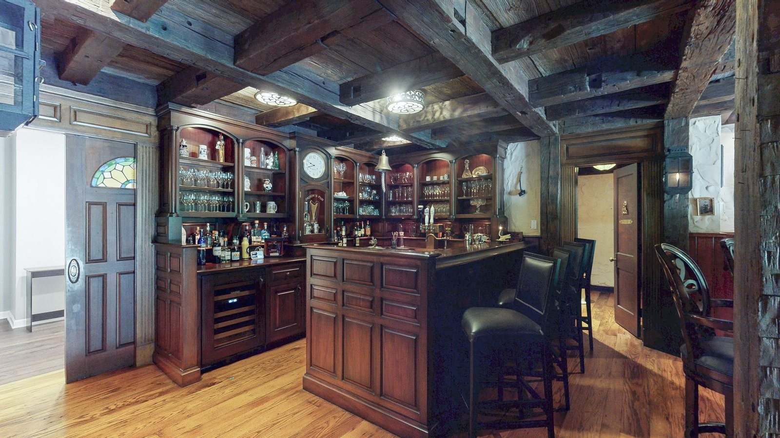 A Cleveland home listed at \$1.6m comes with its own Irish pub, featuring a bar, fireplace and pool table, alongside four bedrooms, marble floors and scenic gardens.