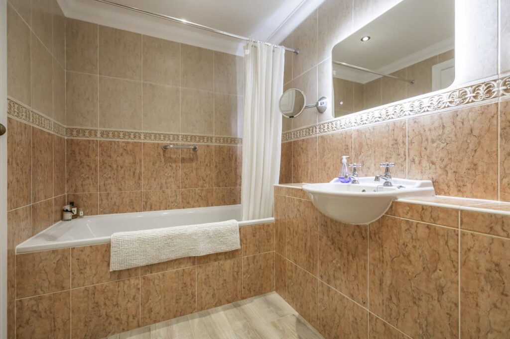 Luxury three bed apartment in Henry VIII’s historic Netley Castle with private beach, sea views, grand hall access, and modern interiors is listed for £800,000.