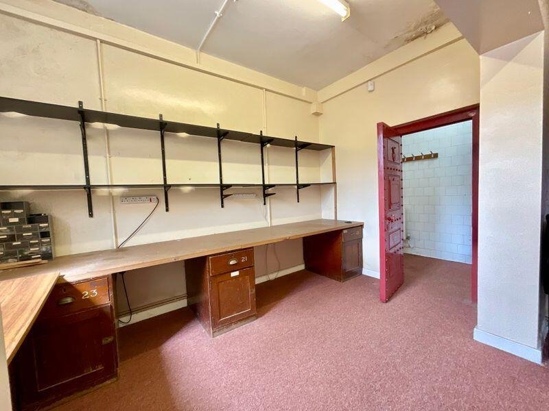Quirky former police station in Stoke-on-Trent with original cells and steel doors for sale at £335,000. Ideal for family home, flats or redevelopment with no chain.