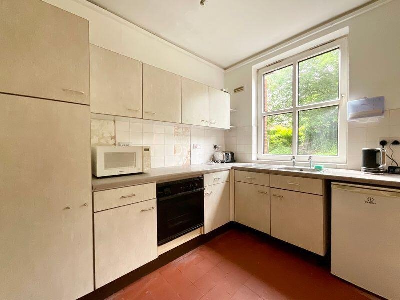Quirky former police station in Stoke-on-Trent with original cells and steel doors for sale at £335,000. Ideal for family home, flats or redevelopment with no chain.