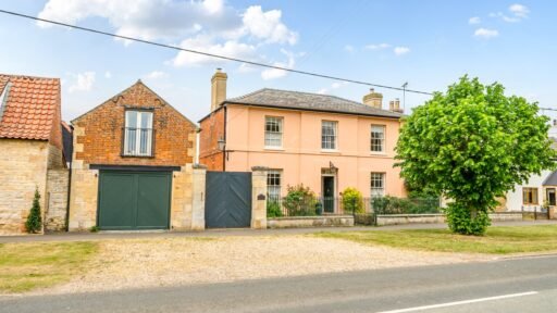 The former Georgian home of Formula One boss Colin Crabbe is for sale at £800,000 featuring elegant period details, annex suites, a walled garden and a swim spa.