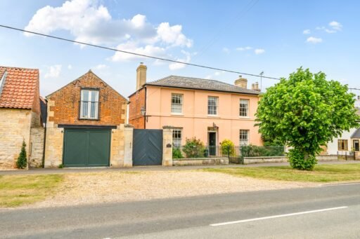 The former Georgian home of Formula One boss Colin Crabbe is for sale at £800,000 featuring elegant period details, annex suites, a walled garden and a swim spa.