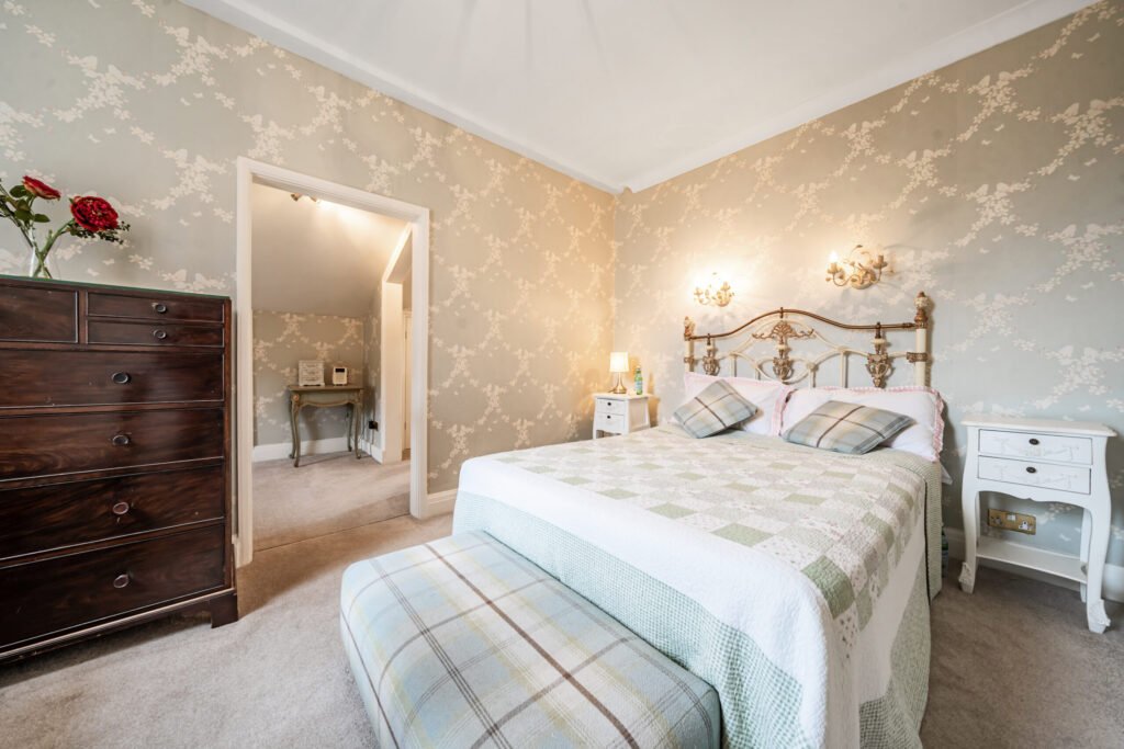 The former Georgian home of Formula One boss Colin Crabbe is for sale at £800,000 featuring elegant period details, annex suites, a walled garden and a swim spa.