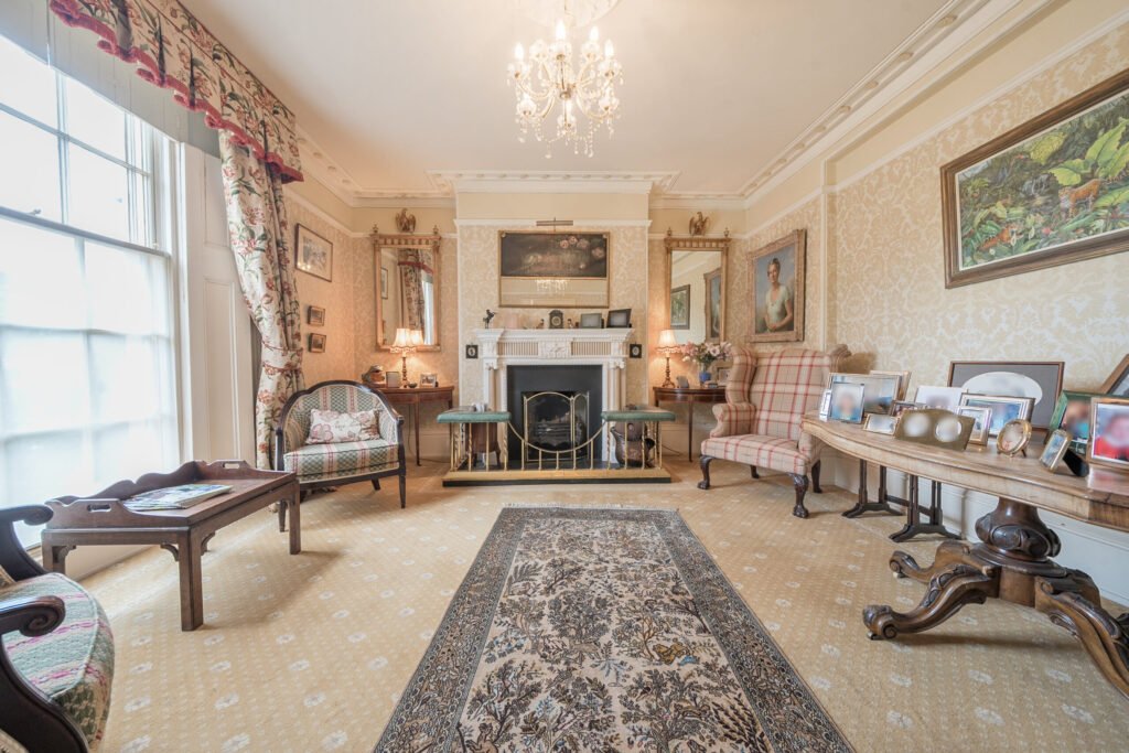 The former Georgian home of Formula One boss Colin Crabbe is for sale at £800,000 featuring elegant period details, annex suites, a walled garden and a swim spa.