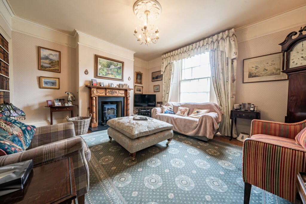 The former Georgian home of Formula One boss Colin Crabbe is for sale at £800,000 featuring elegant period details, annex suites, a walled garden and a swim spa.