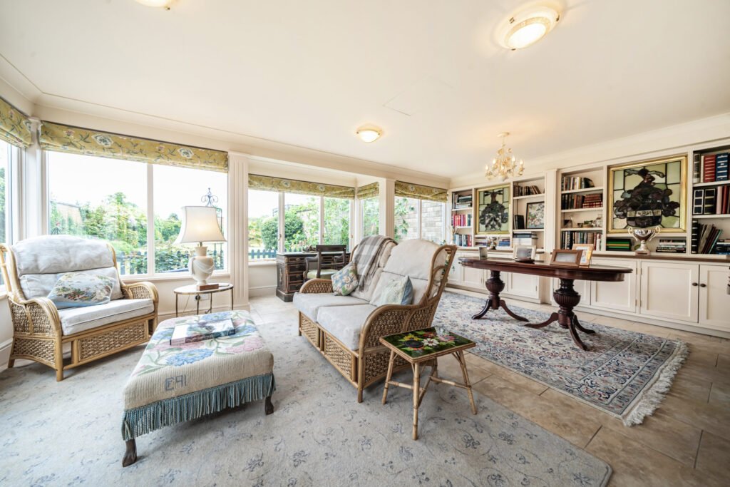 The former Georgian home of Formula One boss Colin Crabbe is for sale at £800,000 featuring elegant period details, annex suites, a walled garden and a swim spa.