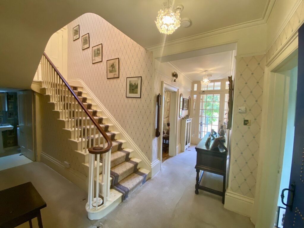 The former Georgian home of Formula One boss Colin Crabbe is for sale at £800,000 featuring elegant period details, annex suites, a walled garden and a swim spa.