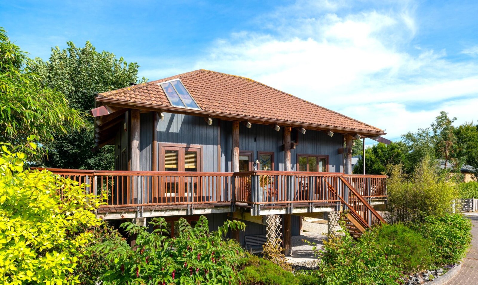 Kate Winslet’s former Japanese-style Pole House in Cornwall is for sale at £600,000, featuring unique stilt design, vaulted ceilings, gardens and coastal charm.
