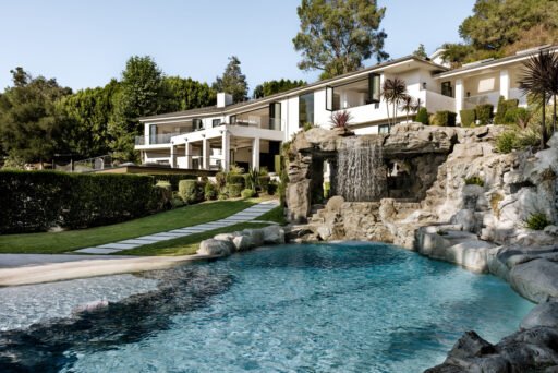 Mark Wahlberg’s former Beverly Hills estate is on the market for \$21.8M featuring seven bedrooms, luxury amenities, a grotto pool, guesthouse, gym and canyon views.