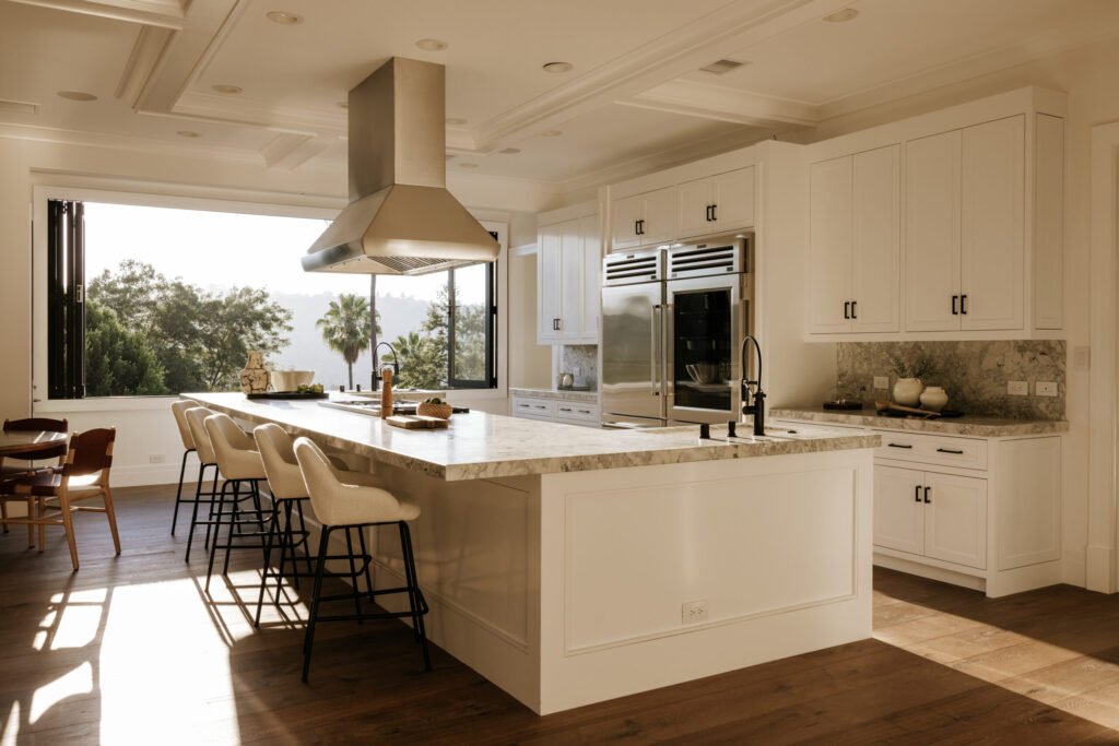 Mark Wahlberg’s former Beverly Hills estate is on the market for \$21.8M featuring seven bedrooms, luxury amenities, a grotto pool, guesthouse, gym and canyon views.