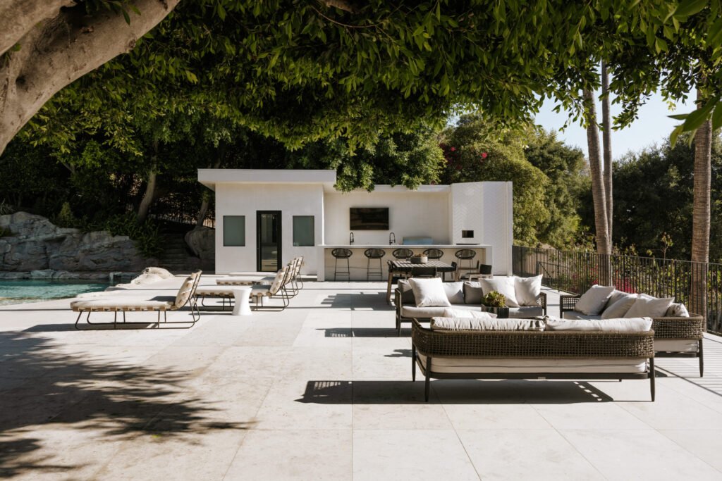 Mark Wahlberg’s former Beverly Hills estate is on the market for \$21.8M featuring seven bedrooms, luxury amenities, a grotto pool, guesthouse, gym and canyon views.