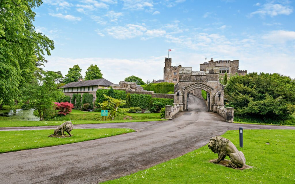 A £900,000 wing of historic Thurland Castle offers four beds, medieval features, cinema, tennis court, wine cellar, and landscaped gardens between the Lakes and Dales.
