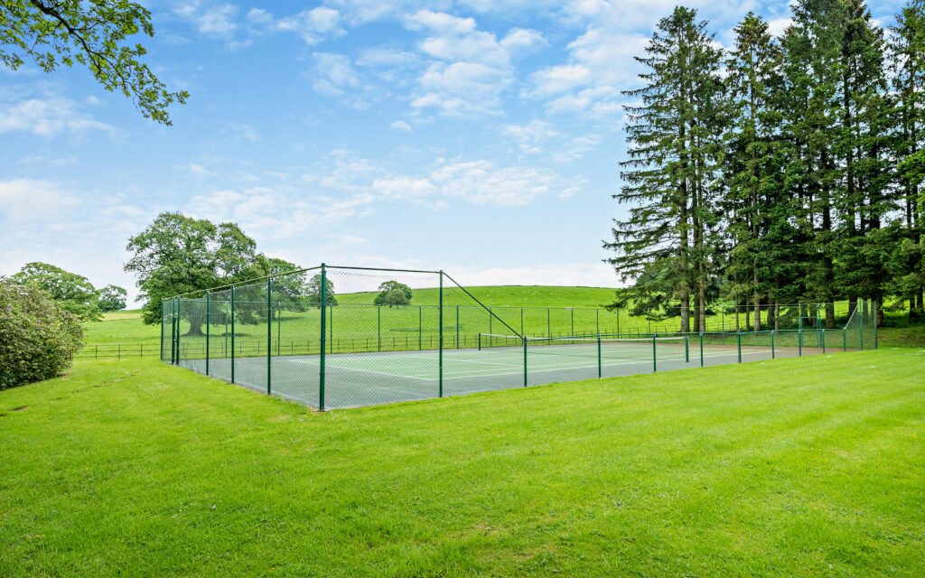 A £900,000 wing of historic Thurland Castle offers four beds, medieval features, cinema, tennis court, wine cellar, and landscaped gardens between the Lakes and Dales.