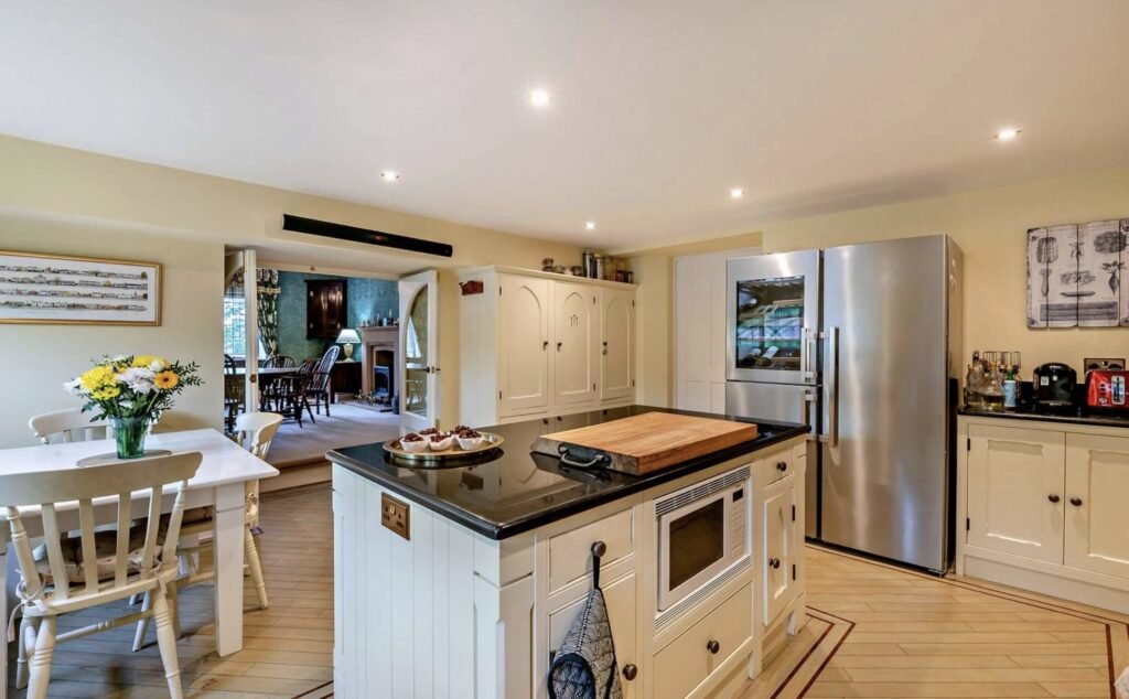 A £900,000 wing of historic Thurland Castle offers four beds, medieval features, cinema, tennis court, wine cellar, and landscaped gardens between the Lakes and Dales.