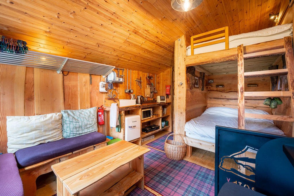 Three quirky eco cabins in Glenfinnan near the Harry Potter viaduct are for sale at £290,000 featuring handcrafted design, scenic views and a shared Swedish style outdoor bath.