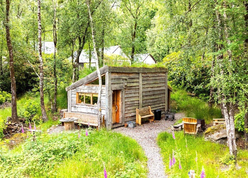 Three quirky eco cabins in Glenfinnan near the Harry Potter viaduct are for sale at £290,000 featuring handcrafted design, scenic views and a shared Swedish style outdoor bath.