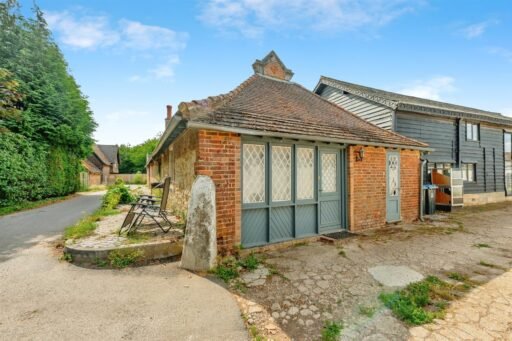 This Surrey home hides a surprise behind its doors with a ground-floor playspace and pole alongside cozy bedrooms, patio and charm, priced at £375,000.
