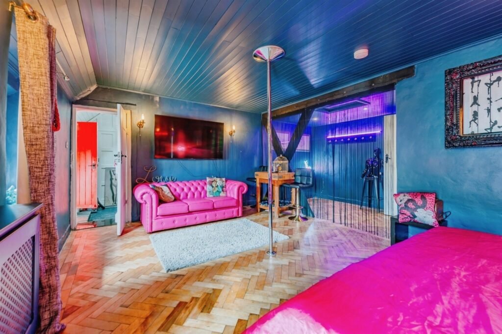 This Surrey home hides a surprise behind its doors with a ground-floor playspace and pole alongside cozy bedrooms, patio and charm, priced at £375,000.