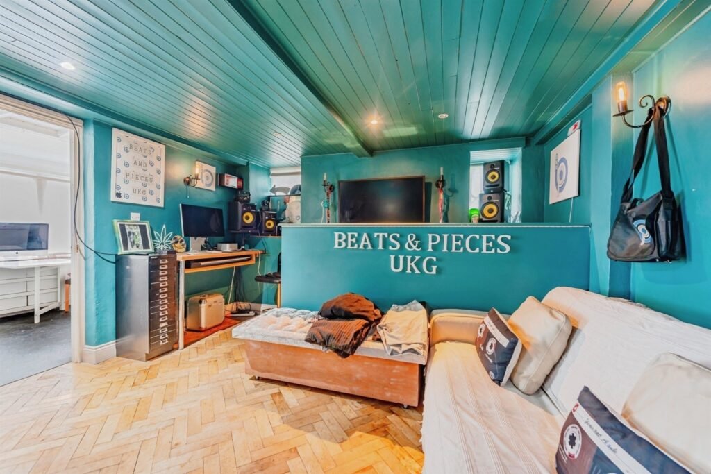 This Surrey home hides a surprise behind its doors with a ground-floor playspace and pole alongside cozy bedrooms, patio and charm, priced at £375,000.
