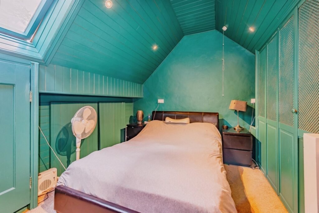 This Surrey home hides a surprise behind its doors with a ground-floor playspace and pole alongside cozy bedrooms, patio and charm, priced at £375,000.