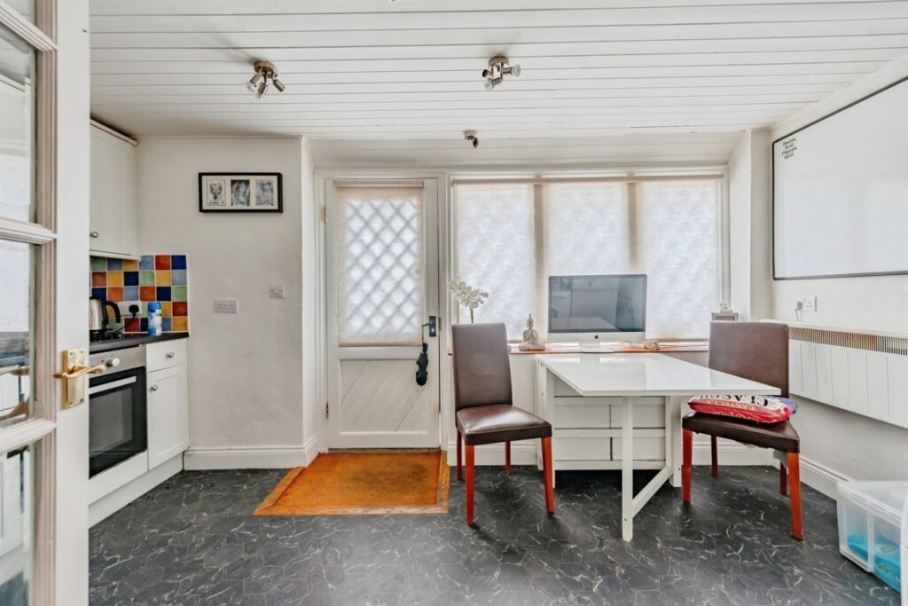 This Surrey home hides a surprise behind its doors with a ground-floor playspace and pole alongside cozy bedrooms, patio and charm, priced at £375,000.