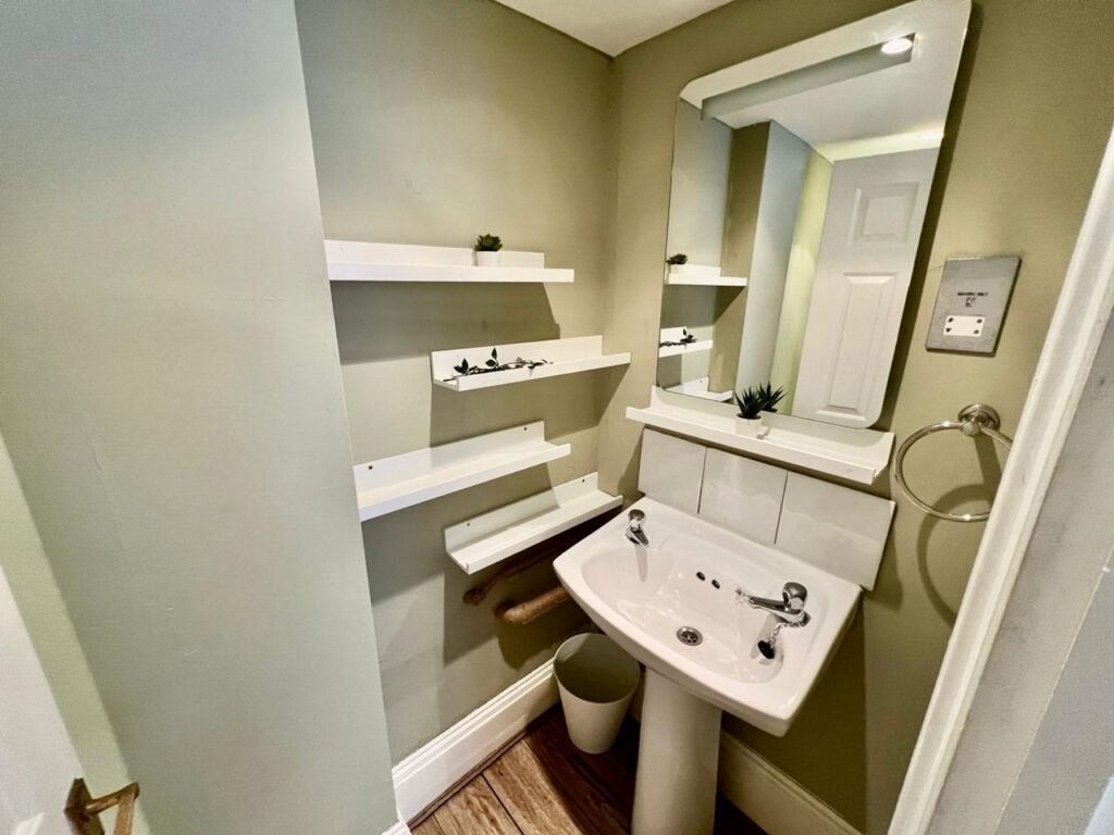 Charming Notting Hill studio with ornate ceiling, mock fireplace and mezzanine bedroom rents for £1,520 a month but comes with limited headroom and quirky layout.