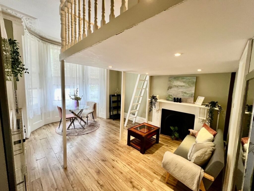 Charming Notting Hill studio with ornate ceiling, mock fireplace and mezzanine bedroom rents for £1,520 a month but comes with limited headroom and quirky layout.
