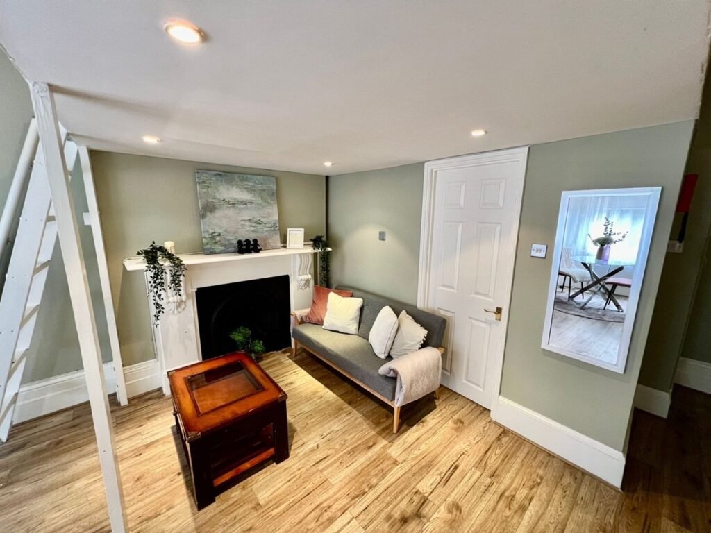 Charming Notting Hill studio with ornate ceiling, mock fireplace and mezzanine bedroom rents for £1,520 a month but comes with limited headroom and quirky layout.