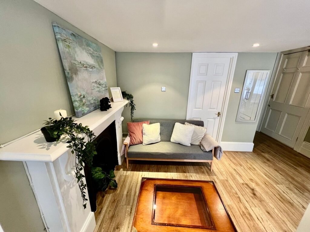 Charming Notting Hill studio with ornate ceiling, mock fireplace and mezzanine bedroom rents for £1,520 a month but comes with limited headroom and quirky layout.