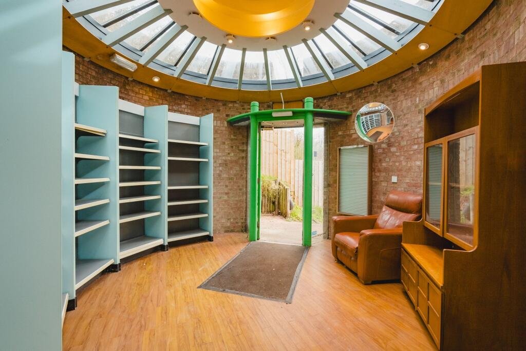 A quirky Hobbit style home in Crediton built into a hillside is on sale for £235,000 offering a unique design, planning permission and a rare development opportunity.