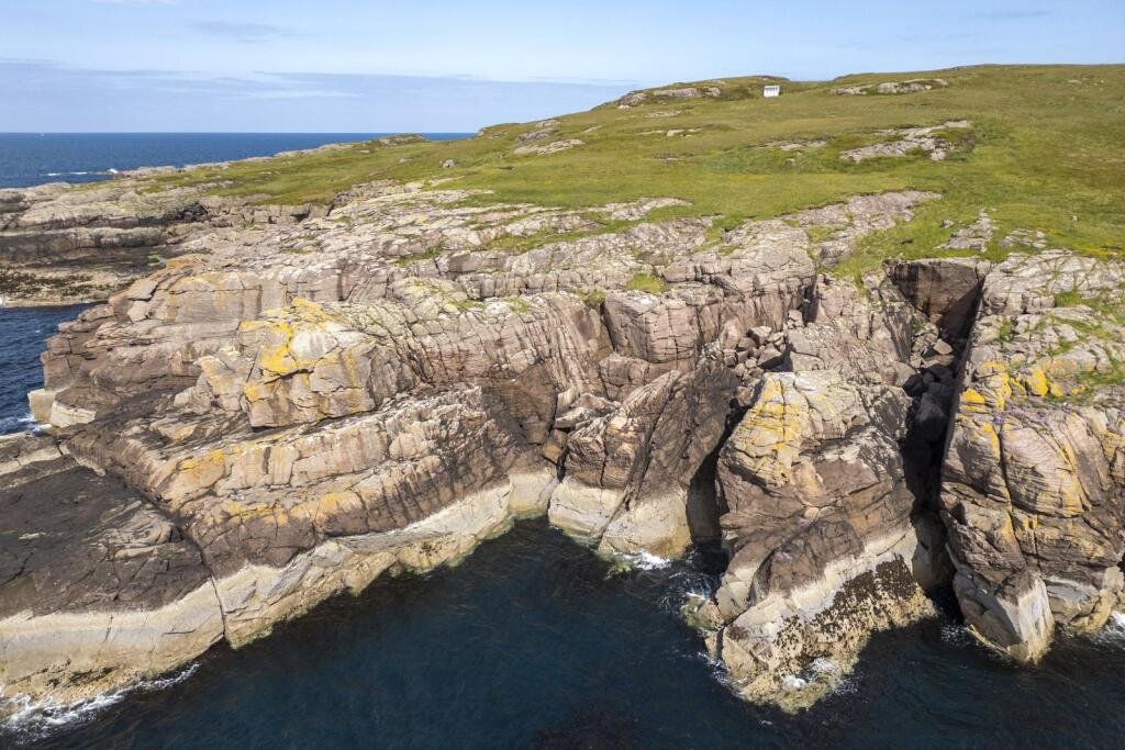Mullagrach Island in Scotland’s Summer Isles is now £400,000, offering 88 acres of rugged beauty, eco cabin, wildlife conservation and total off-grid seclusion.