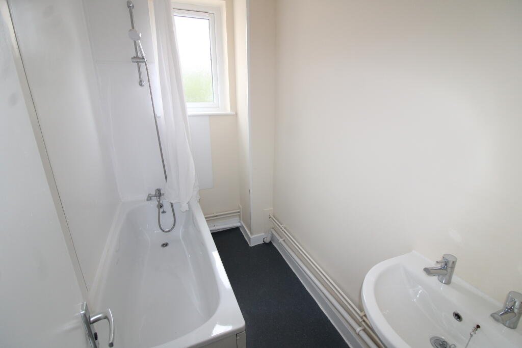 Three bedroom flat above Tim Hortons drive thru in Weston Super Mare for £1400 a month offers fresh interiors, lounge and bathroom with town and seafront access.