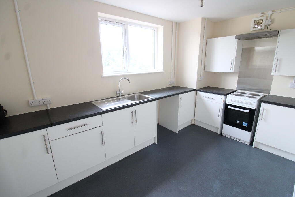 Three bedroom flat above Tim Hortons drive thru in Weston Super Mare for £1400 a month offers fresh interiors, lounge and bathroom with town and seafront access.
