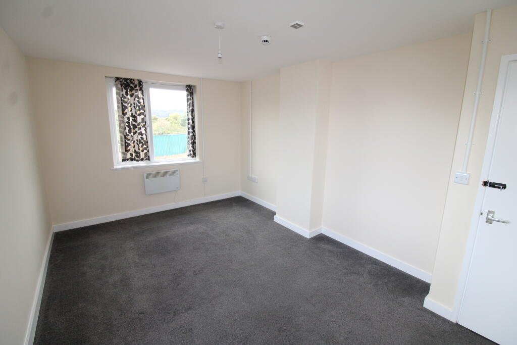 Three bedroom flat above Tim Hortons drive thru in Weston Super Mare for £1400 a month offers fresh interiors, lounge and bathroom with town and seafront access.