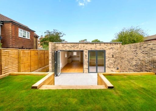 A tiny one bedroom brick cabin in Effingham is on sale for £475k, over £200k above the UK average, offering modern design, a private garden and eco friendly features.