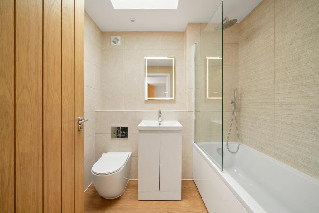 A tiny one bedroom brick cabin in Effingham is on sale for £475k, over £200k above the UK average, offering modern design, a private garden and eco friendly features.