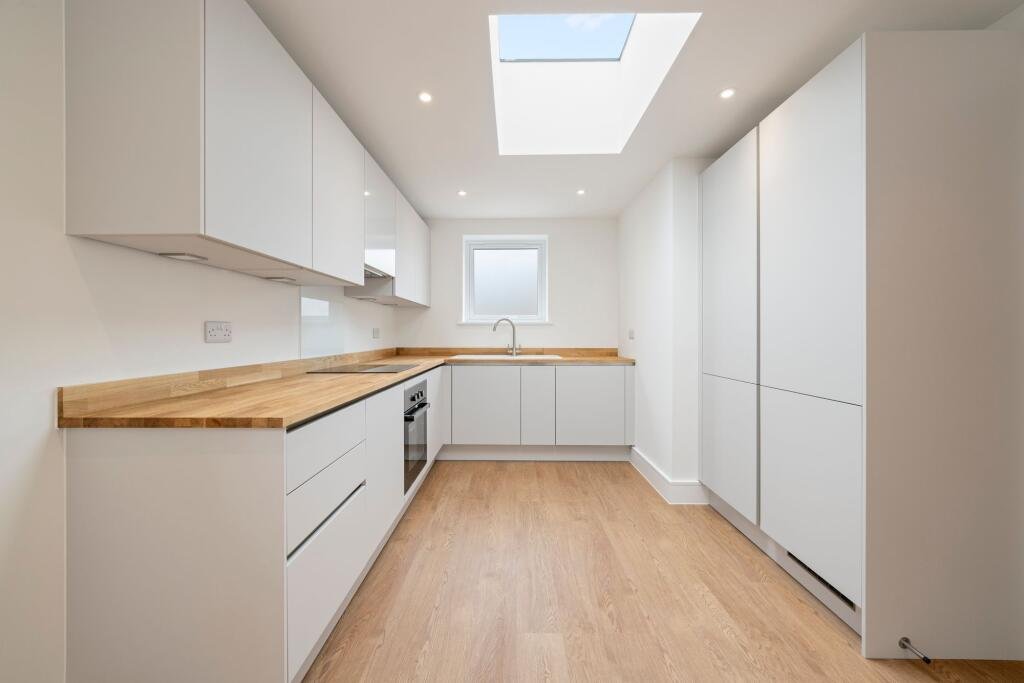 A tiny one bedroom brick cabin in Effingham is on sale for £475k, over £200k above the UK average, offering modern design, a private garden and eco friendly features.