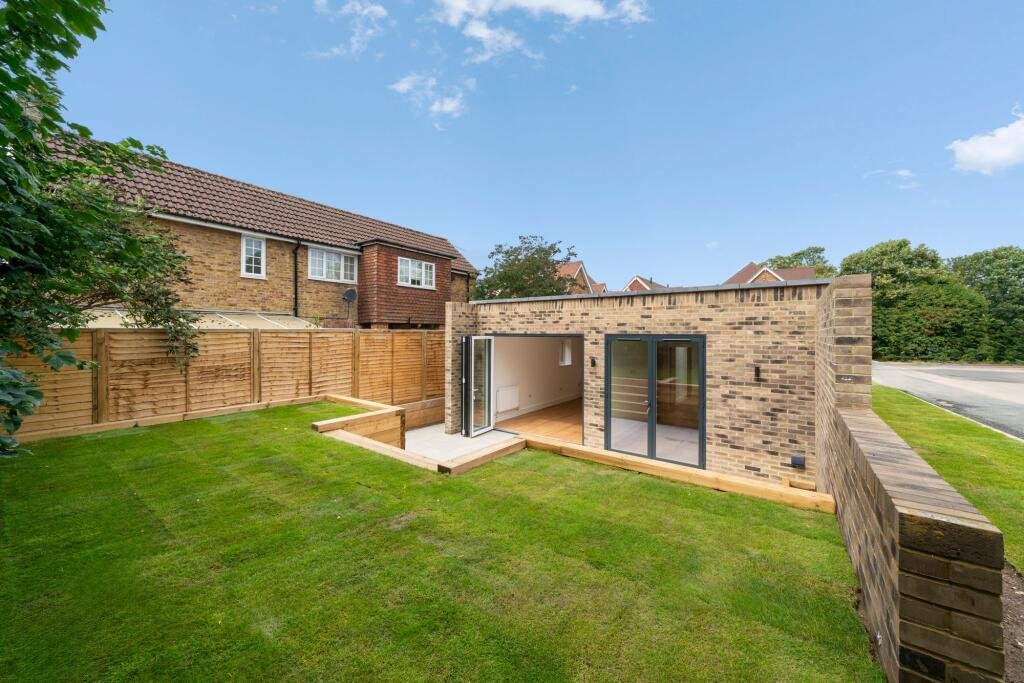 A tiny one bedroom brick cabin in Effingham is on sale for £475k, over £200k above the UK average, offering modern design, a private garden and eco friendly features.