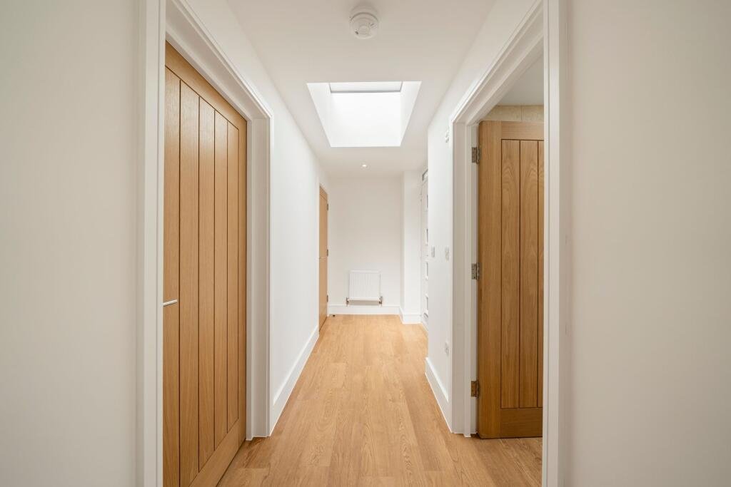 A tiny one bedroom brick cabin in Effingham is on sale for £475k, over £200k above the UK average, offering modern design, a private garden and eco friendly features.
